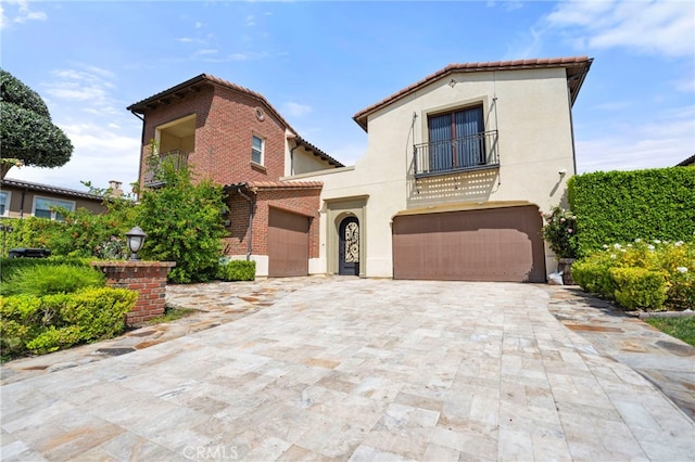 2825 Majestic St, West Covina, CA 91791 - mediterranean / spanish home with a balcony, a garage, stucco siding, decorative driveway, and a tile roof
