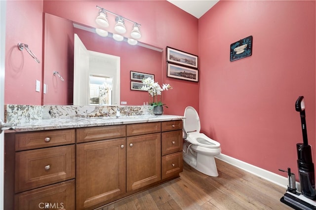 2825 Majestic St, West Covina, CA 91791 - bathroom with toilet, wood finished floors, vanity, and baseboards