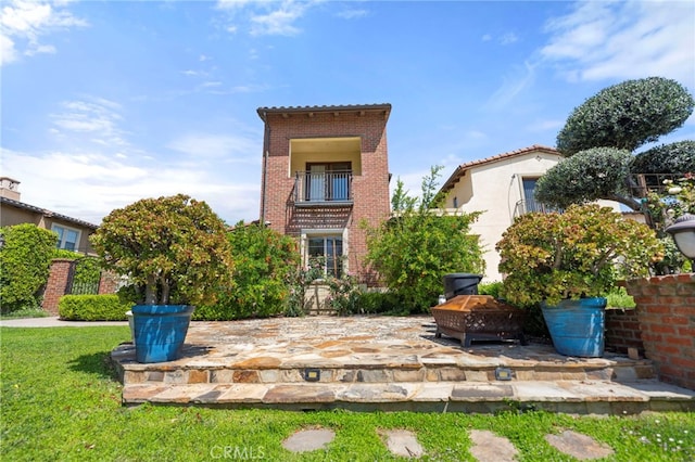 2825 Majestic St, West Covina, CA 91791 - rear view of house featuring brick siding and a patio