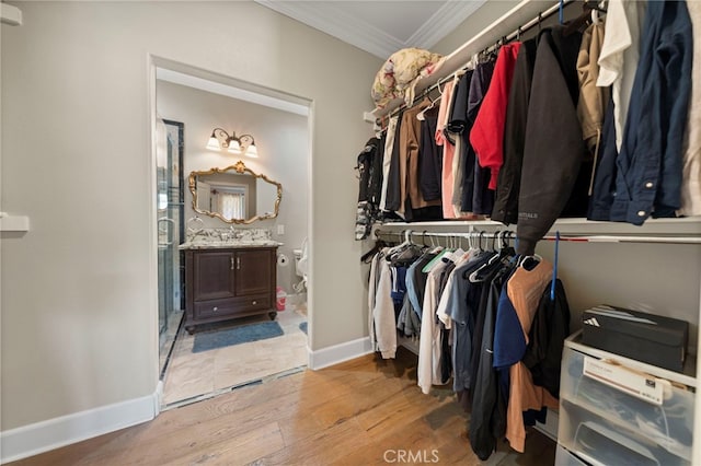 2825 Majestic St, West Covina, CA 91791 - spacious closet with light wood finished floors and a sink