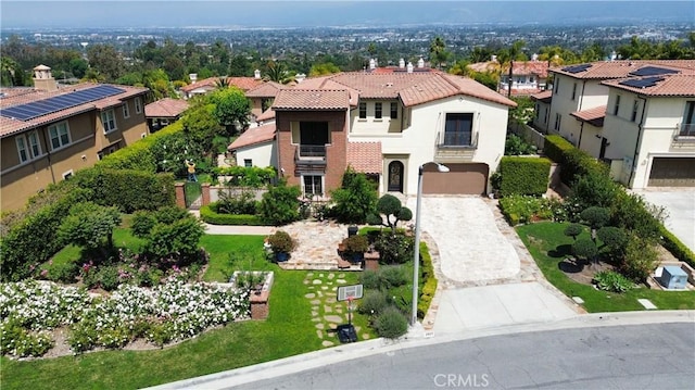 2825 Majestic St, West Covina, CA 91791 - view of front of property with a balcony, a residential view, driveway, an attached garage, and a tiled roof
