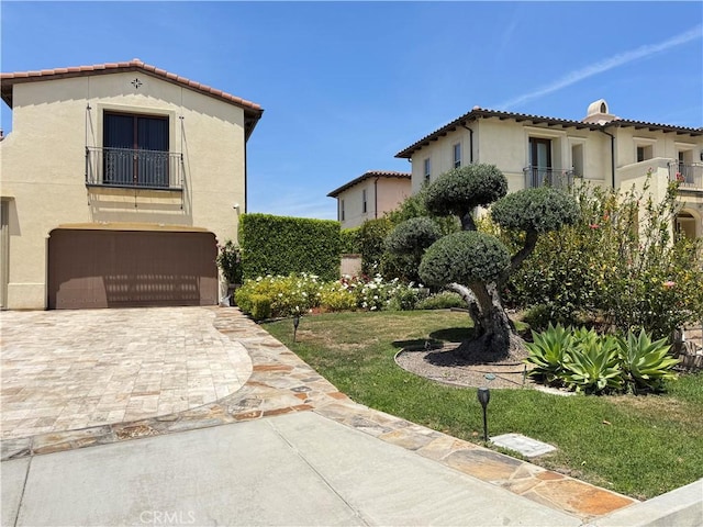 2825 Majestic St, West Covina, CA 91791 - mediterranean / spanish home with a garage, stucco siding, a balcony, a tiled roof, and driveway