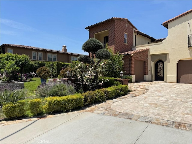 2825 Majestic St, West Covina, CA 91791 - mediterranean / spanish-style home with a tile roof, stucco siding, and driveway