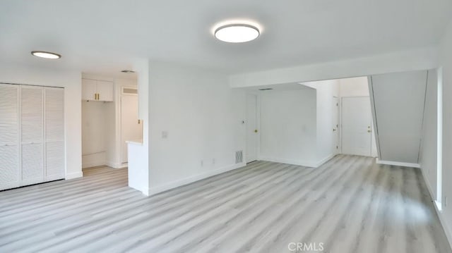 7909 Primrose Ln, Highland, CA 92346 - unfurnished bedroom with a closet, light wood-type flooring, and baseboards