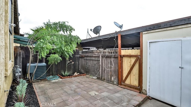 7909 Primrose Ln, Highland, CA 92346 - view of patio / terrace with central AC unit and fence