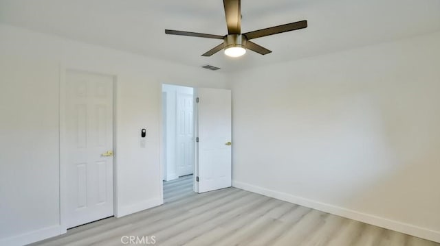7909 Primrose Ln, Highland, CA 92346 - unfurnished bedroom featuring light wood-style flooring, baseboards, and ceiling fan