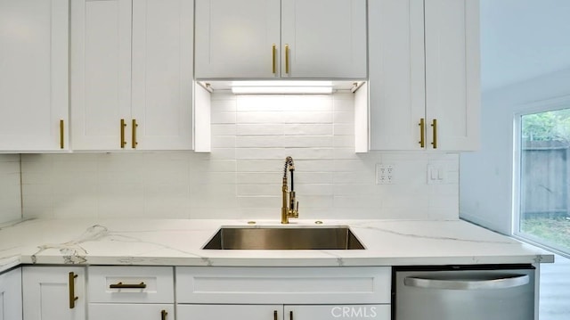 7909 Primrose Ln, Highland, CA 92346 - kitchen with stainless steel dishwasher, a sink, and white cabinetry