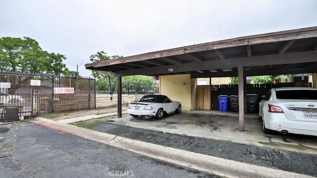 7909 Primrose Ln, Highland, CA 92346 - covered parking lot with fence