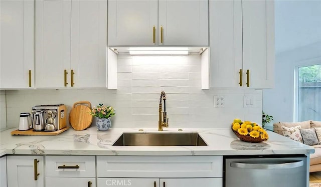 7909 Primrose Ln, Highland, CA 92346 - kitchen with dishwasher, white cabinetry, backsplash, and light stone countertops