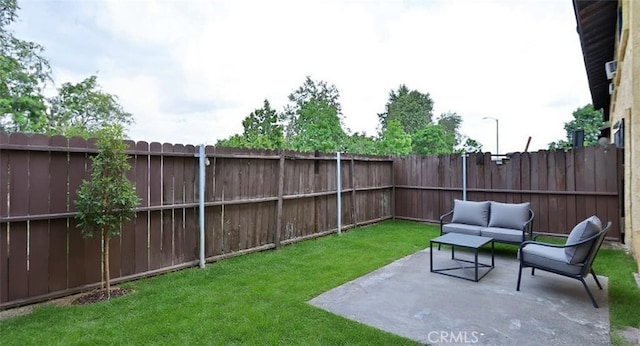 7909 Primrose Ln, Highland, CA 92346 - fenced backyard featuring a patio and an outdoor living space