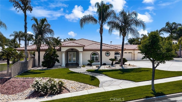 4009 Cerveza Cir, Corona, CA 92881 - mediterranean / spanish house with french doors, a tiled roof, concrete driveway, stucco siding, and an attached garage