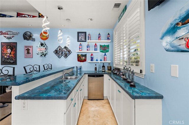 4009 Cerveza Cir, Corona, CA 92881 - indoor wet bar featuring stainless steel dishwasher, decorative light fixtures, and light tile patterned flooring