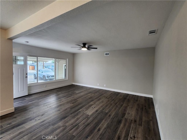 880 S State St, Hemet, CA 92543 - spare room with dark wood-type flooring, a ceiling fan, and a textured ceiling