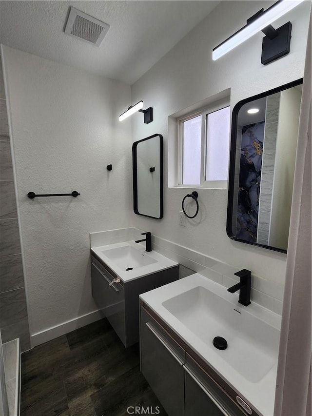 880 S State St, Hemet, CA 92543 - bathroom featuring two vanities and wood finished floors