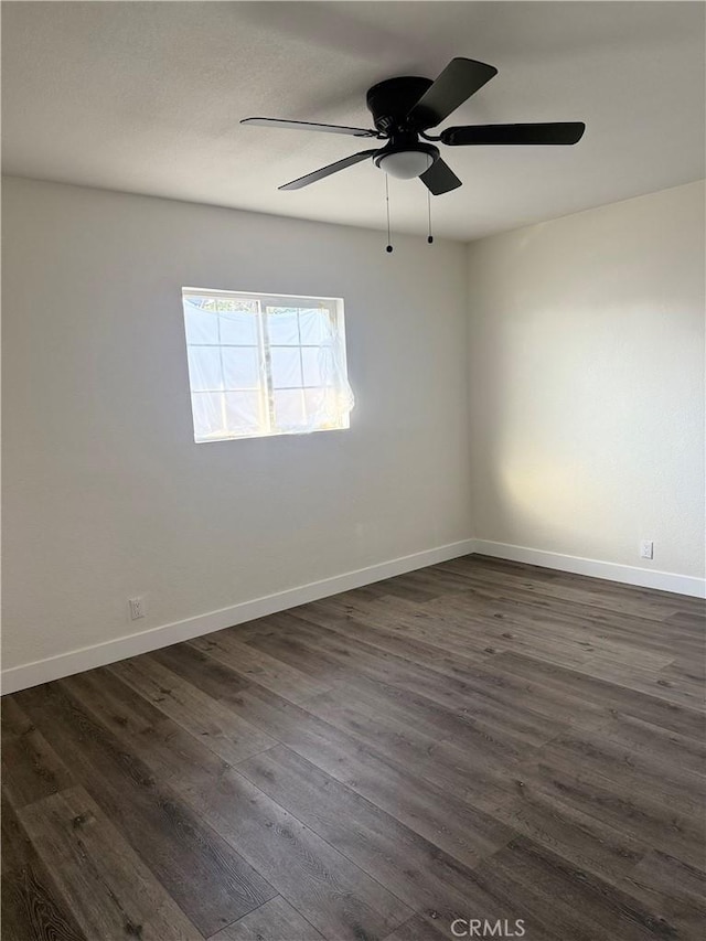 880 S State St, Hemet, CA 92543 - empty room featuring dark wood finished floors and a ceiling fan