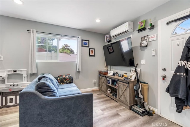 21114 Martin St, Carson, CA 90745 - living area featuring a wall mounted air conditioner, plenty of natural light, light wood finished floors, recessed lighting, and baseboards