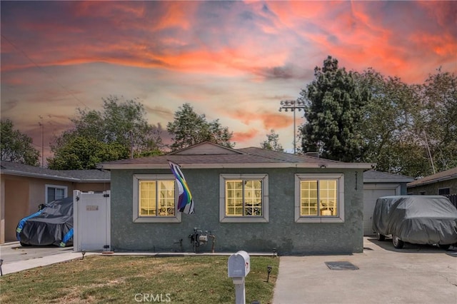 21114 Martin St, Carson, CA 90745 - back of house at dusk with a yard and stucco siding