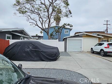 4107 37th St, San Diego, CA 92105 - view of side of property with concrete driveway and an outdoor structure