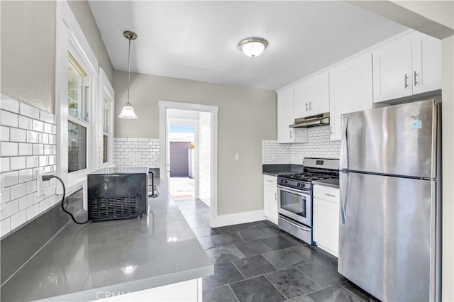 4107 37th St, San Diego, CA 92105 - kitchen featuring appliances with stainless steel finishes, decorative backsplash, white cabinets, and under cabinet range hood