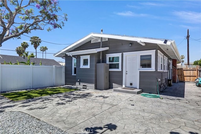 4107 37th St, San Diego, CA 92105 - rear view of property featuring a fenced backyard and a patio area