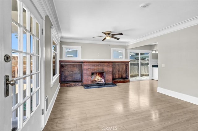 4107 37th St, San Diego, CA 92105 - unfurnished living room featuring a ceiling fan, a brick fireplace, crown molding, and wood finished floors