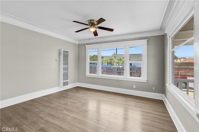 4107 37th St, San Diego, CA 92105 - unfurnished room featuring a heating unit, ornamental molding, ceiling fan, and wood finished floors