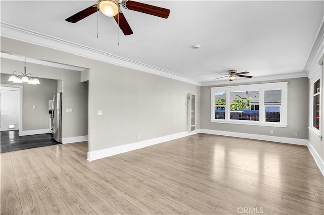 4107 37th St, San Diego, CA 92105 - unfurnished room featuring a ceiling fan, ornamental molding, wood finished floors, and a chandelier