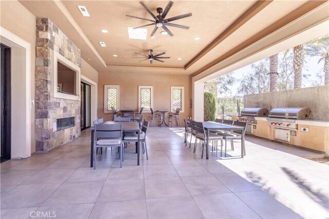 20621 Chestnut Cir, Porter Ranch, CA 91326 - view of patio / terrace with outdoor dining space, an outdoor kitchen, a grill, and ceiling fan