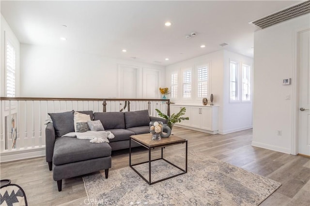 20621 Chestnut Cir, Porter Ranch, CA 91326 - living area with light wood-type flooring, recessed lighting, and baseboards