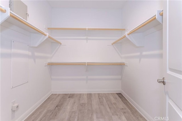 20621 Chestnut Cir, Porter Ranch, CA 91326 - walk in closet with wood finished floors
