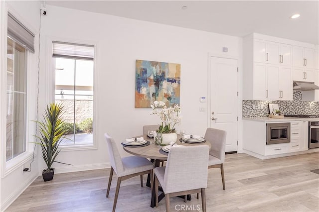 20621 Chestnut Cir, Porter Ranch, CA 91326 - dining area featuring light wood-style floors, baseboards, and recessed lighting