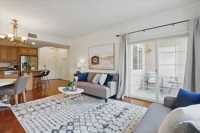21345 Hawthorne Blvd Unit 126, Torrance, CA 90503 - living room with ornamental molding, light wood-style flooring, and a chandelier