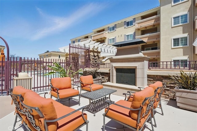 21345 Hawthorne Blvd Unit 126, Torrance, CA 90503 - view of patio featuring an outdoor living space with a fireplace and fence