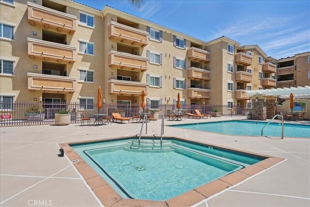 21345 Hawthorne Blvd Unit 126, Torrance, CA 90503 - view of swimming pool featuring fence
