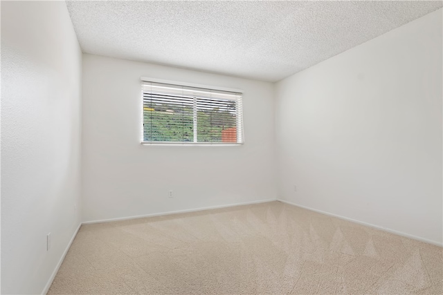 15555 Crestview Ln Unit 94, Granada Hills, CA 91344 - spare room with carpet floors, a textured ceiling, and baseboards