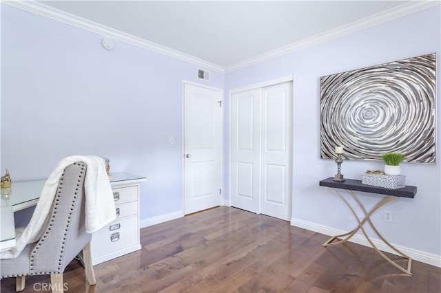office space featuring baseboards, wood finished floors, and ornamental molding