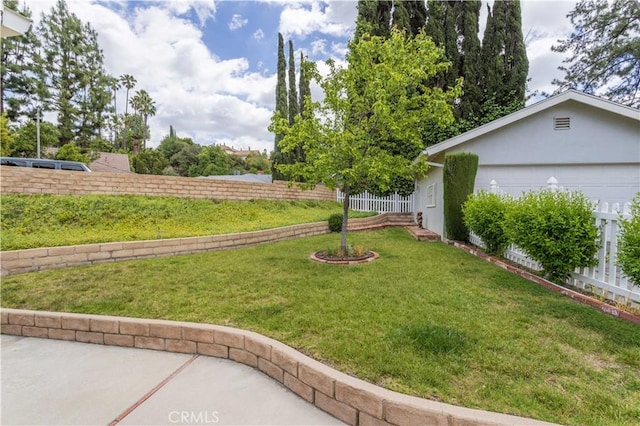 view of yard featuring a garage