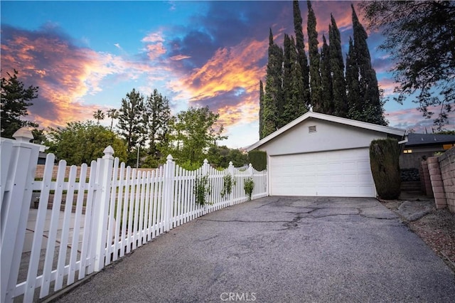 garage featuring fence