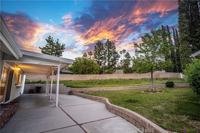 view of patio terrace at dusk