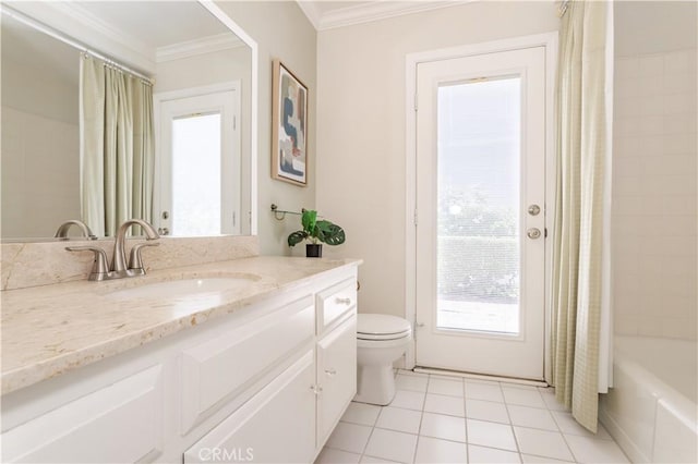 full bath with toilet, tile patterned flooring, ornamental molding, vanity, and shower / tub combo