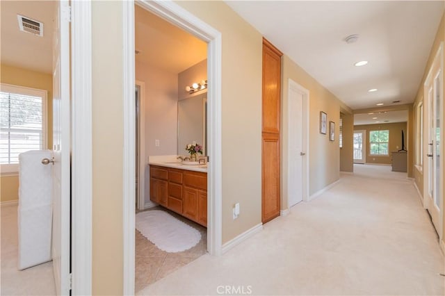 12538 Old Port Ct, Rancho Cucamonga, CA 91739 - hall with recessed lighting, baseboards, and light colored carpet