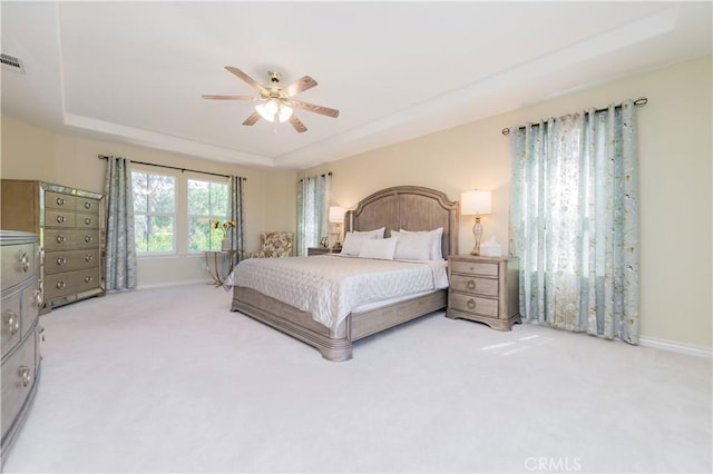 12538 Old Port Ct, Rancho Cucamonga, CA 91739 - carpeted bedroom with a raised ceiling, baseboards, and a ceiling fan