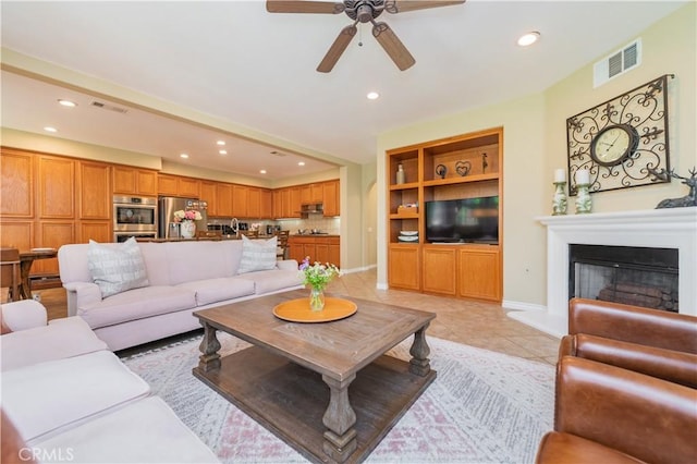 12538 Old Port Ct, Rancho Cucamonga, CA 91739 - living room featuring ceiling fan, recessed lighting, a fireplace with raised hearth, light tile patterned flooring, and baseboards