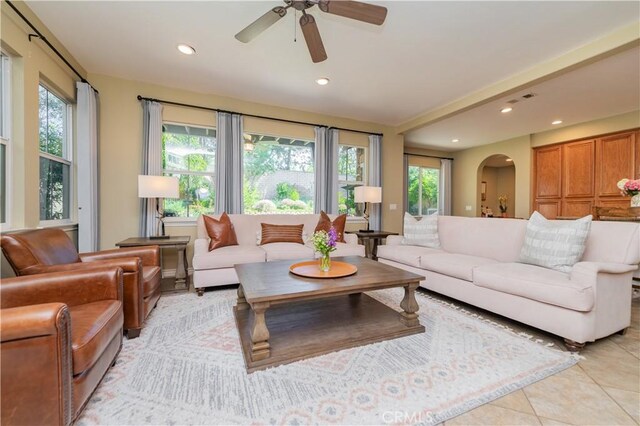 12538 Old Port Ct, Rancho Cucamonga, CA 91739 - living area with arched walkways, recessed lighting, ceiling fan, and light tile patterned floors
