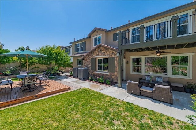 12538 Old Port Ct, Rancho Cucamonga, CA 91739 - rear view of property featuring stone siding, outdoor lounge area, stucco siding, a ceiling fan, and a wooden deck