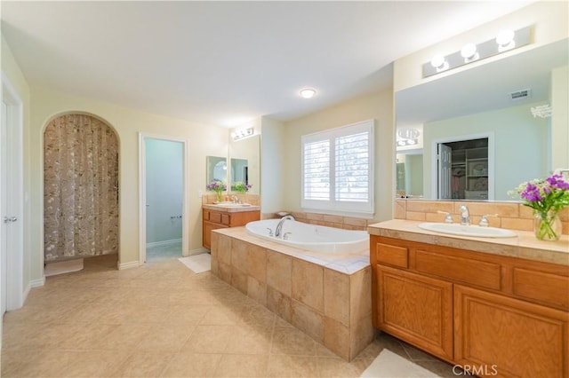 12538 Old Port Ct, Rancho Cucamonga, CA 91739 - full bath featuring two vanities, a garden tub, and tile patterned floors