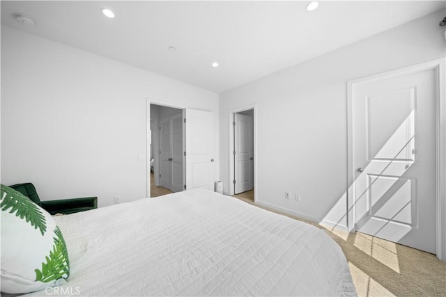 bedroom with recessed lighting, baseboards, and carpet floors