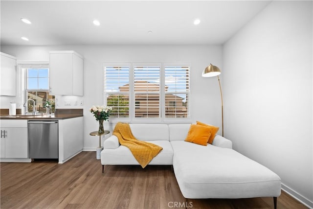 sitting room with recessed lighting, wood finished floors, and baseboards