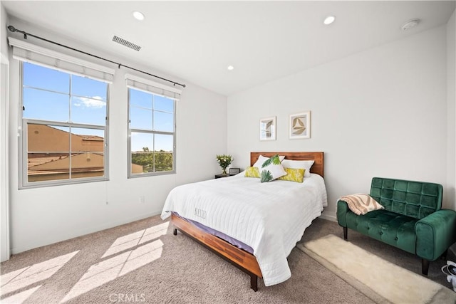 bedroom with multiple windows, carpet, recessed lighting, and baseboards