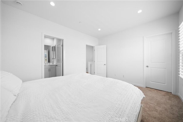 carpeted bedroom featuring recessed lighting and connected bathroom